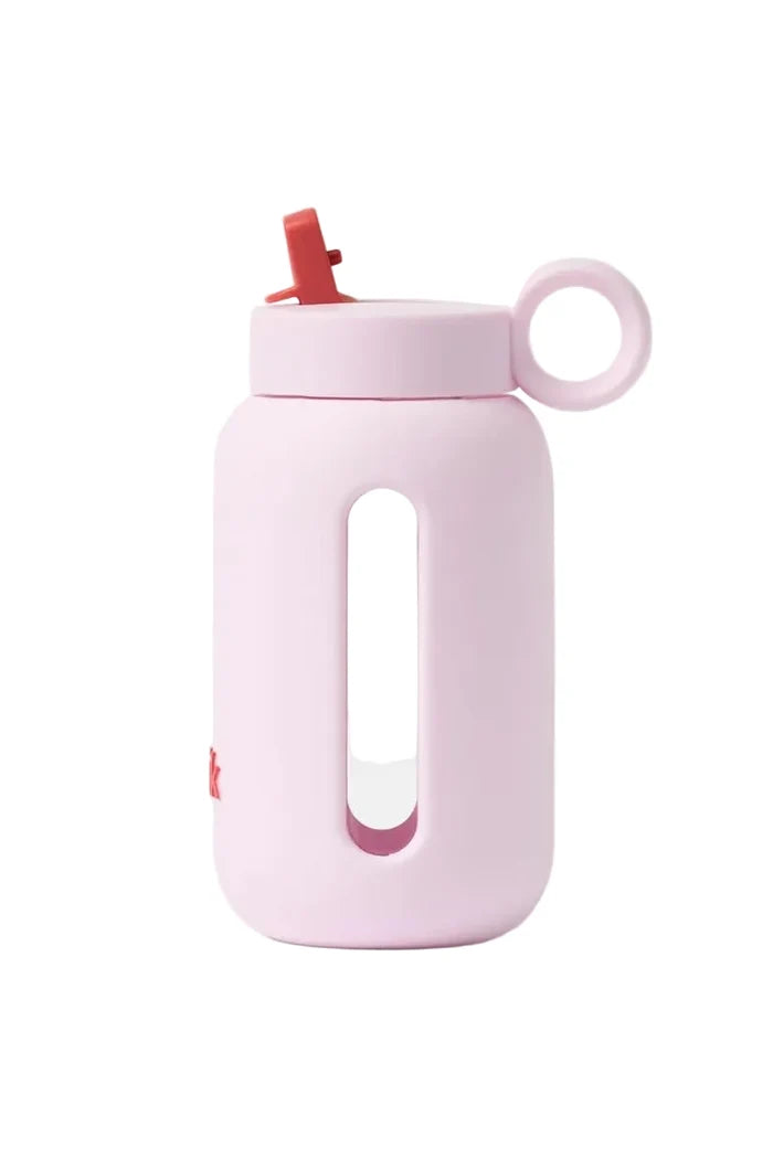 Pink water bottle with a straw on a white background