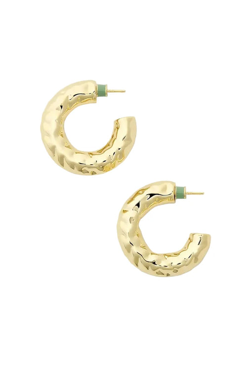 Gold textured hoop earrings on a white background