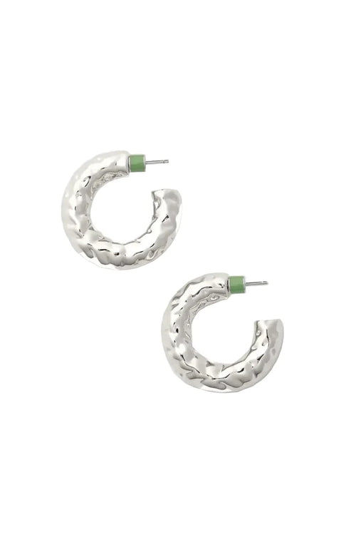 Silver hoop earrings with green backs on a white background