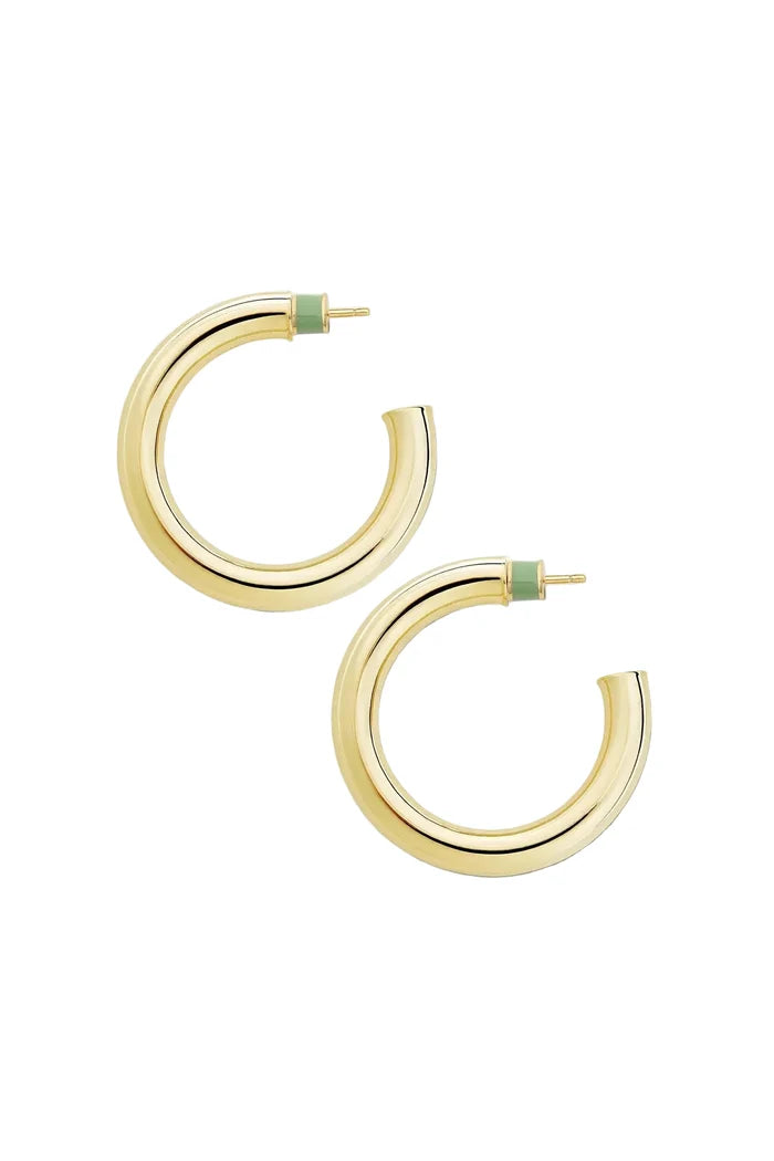 Gold hoop earrings with green accents on a white background