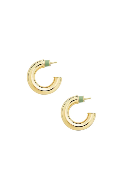 A pair of gold hoop earrings with a small light green enamel accent at the post, displayed on a clean off-white background.