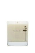 Beige candle with 'Maison Louis Marie' branding on a white background