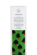 Cedar wood incense packaging with green tree pattern on a white background