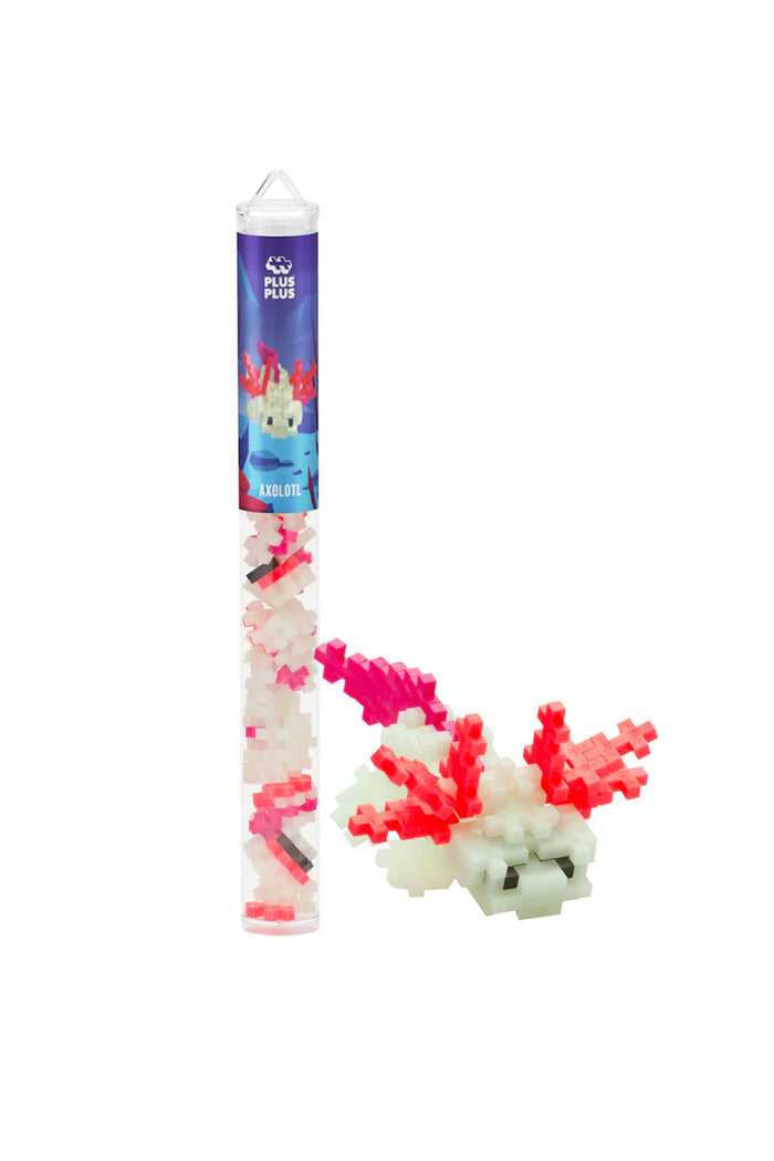 A craft kit toy called 'Axolotl' with various colorful pieces, including a clear tube packaging with a blue and pink label featuring an axolotl (a type of salamander) design.