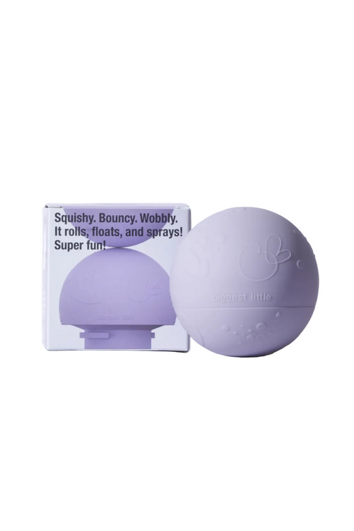 Purple toy with packaging on a white background