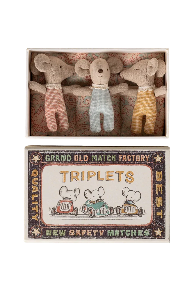 Three small mouse toys in a matchbox with a vintage-style label.