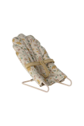 Floral-patterned mini baby bouncer with stand on a white background