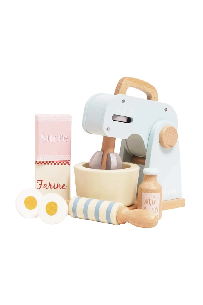 Set of wooden kitchen toys including a mixer, eggs, and bottles on a white background