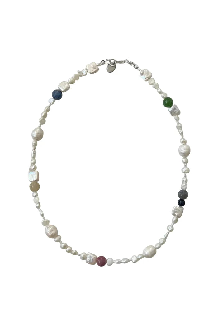 Pearl necklace with agate accents on a white background
