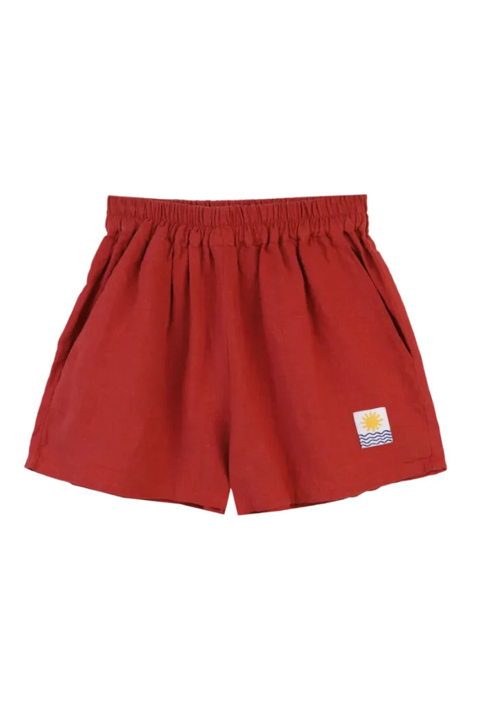 Red shorts with a logo on a white background