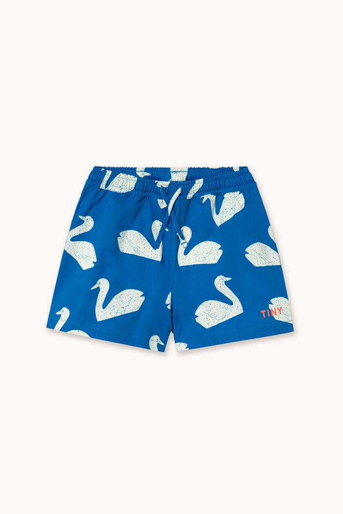 Blue swim shorts with white swan pattern on a white background