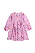 Pink dress with colorful pattern on a white background
