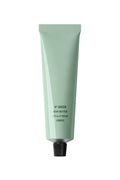 Green body butter tube on a light green background