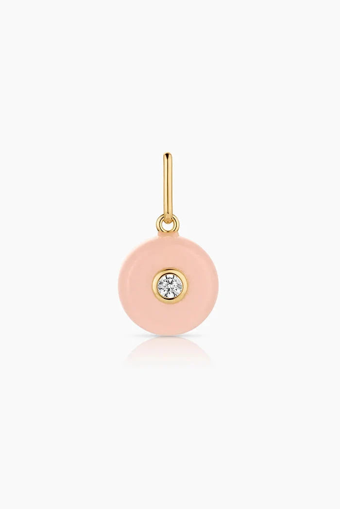 Pink pendant with inset gem on a white background