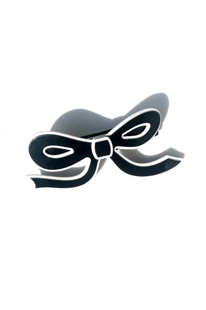 Black acetate bow shaped hair clip with white border