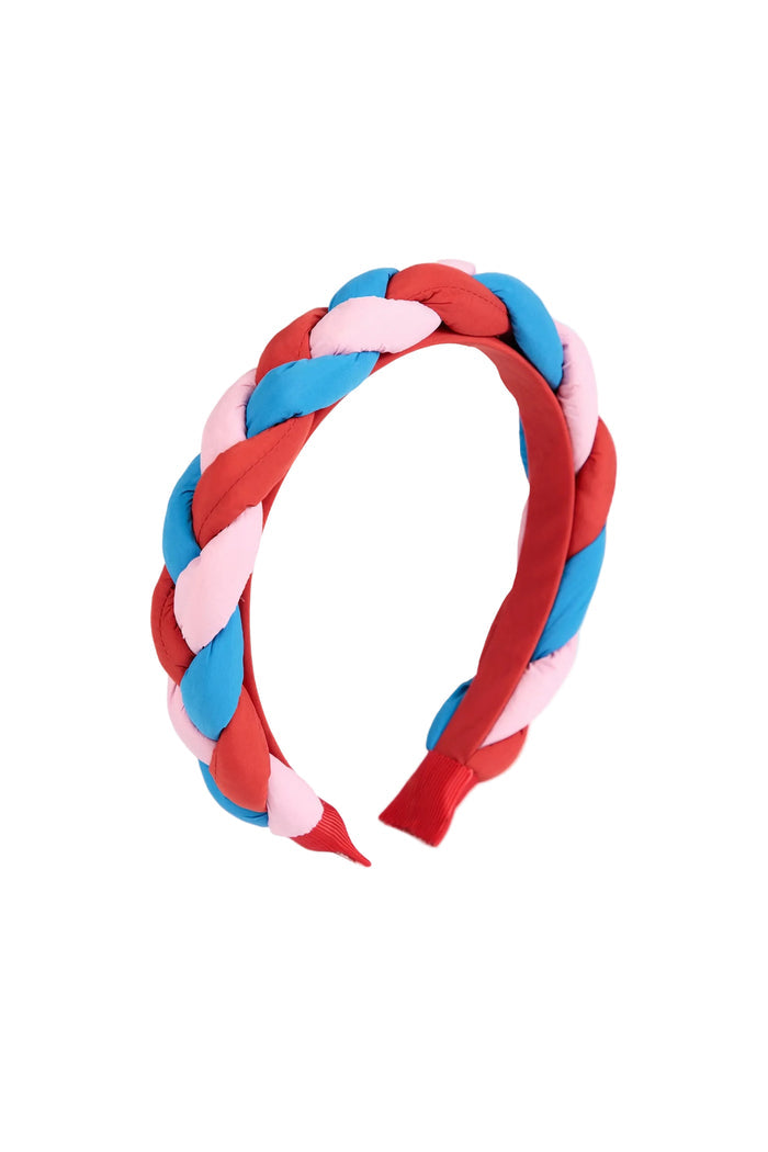 A wide, padded braided headband in alternating stripes of red, light pink, and sky blue, shown on a clean white background.