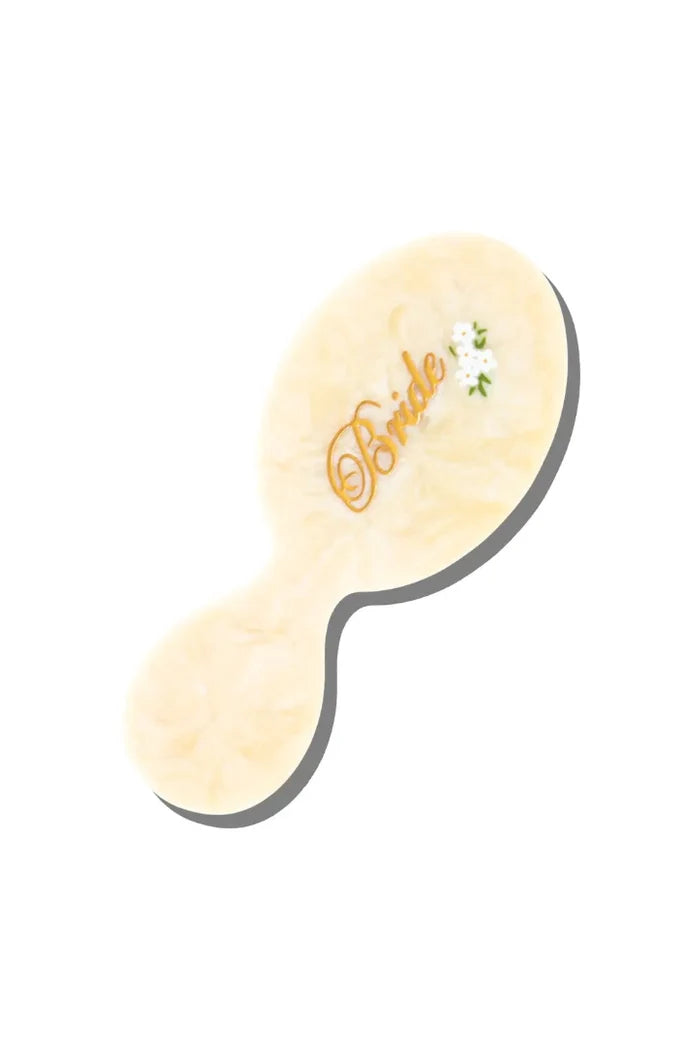 Hairbrush with 'Bride' text on a white background
