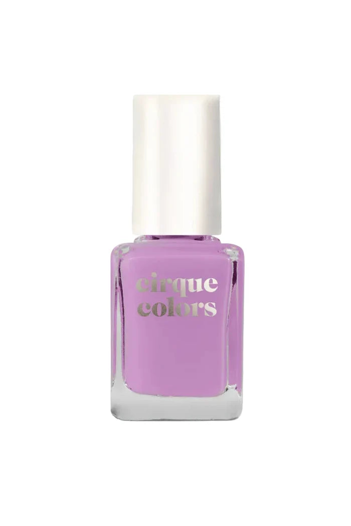 Purple nail polish bottle with 'cirque colors' text on a light gray background