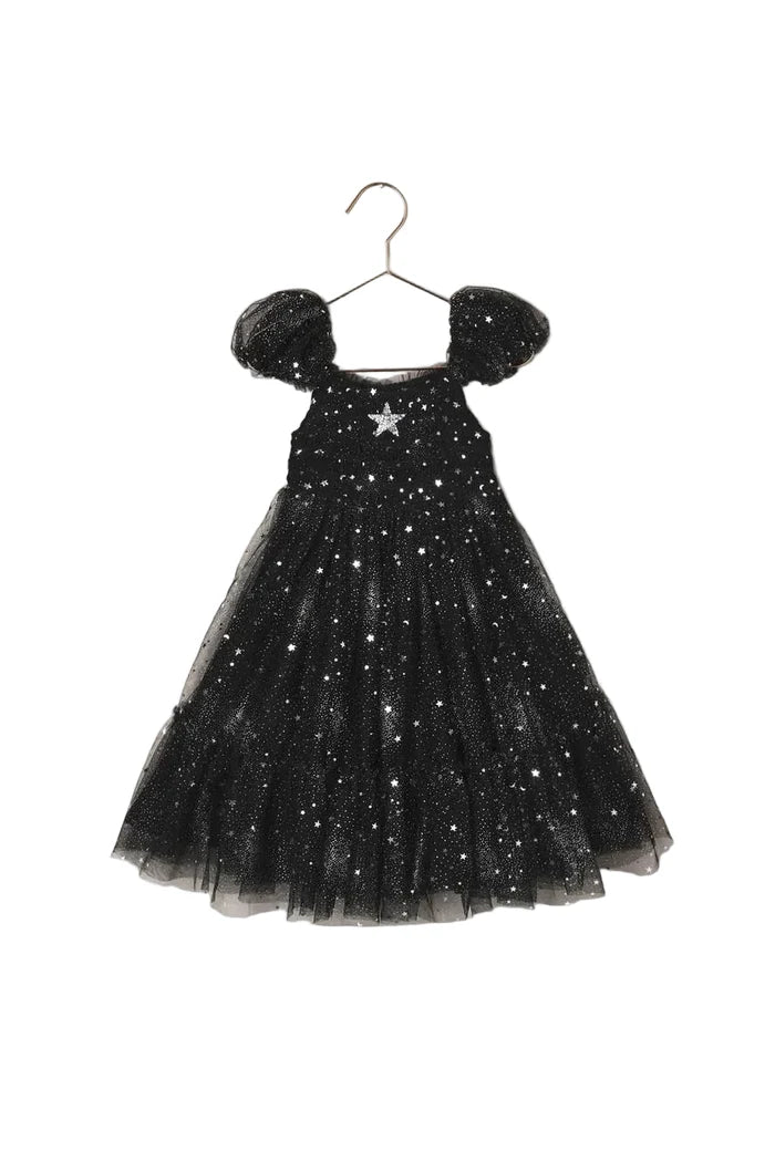 Black sparkly dress on a beige background