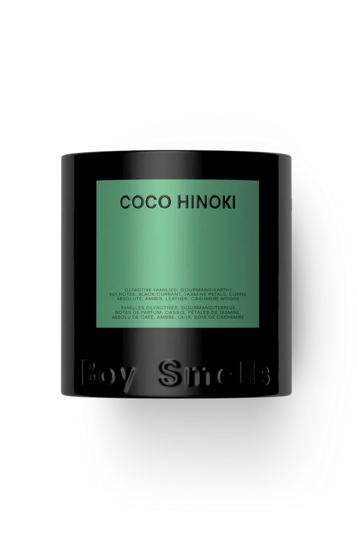 A black cylindrical candle jar with a green label reading 'COCO HINOKI' and embossed 'Boy Smells' at the bottom, centered on a white background.