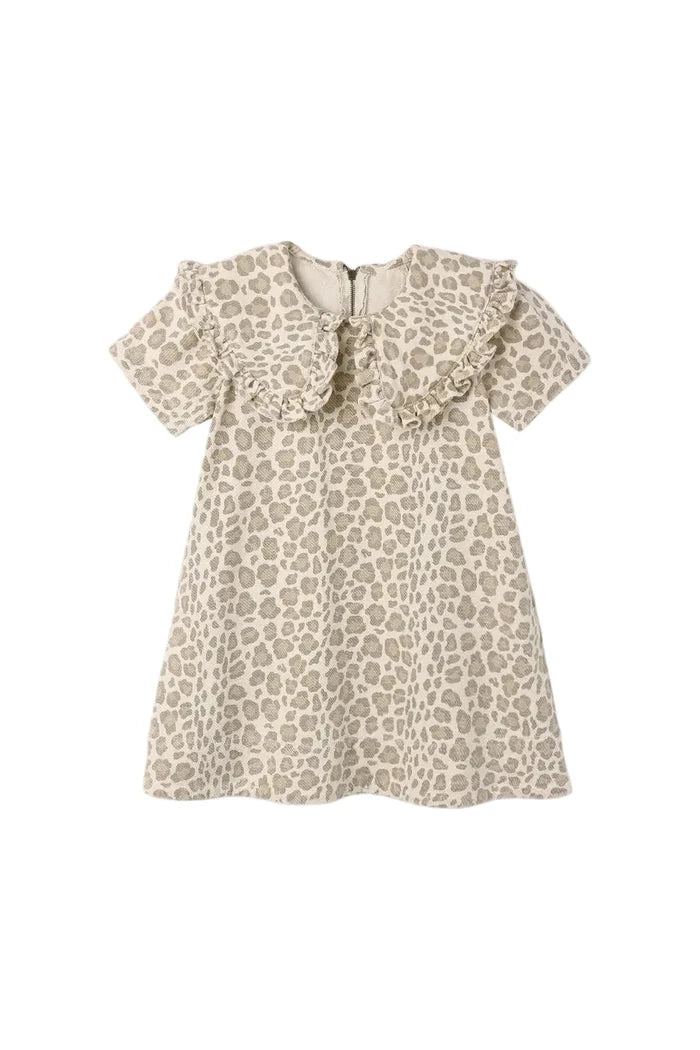 A short-sleeve babydoll dress with a beige and brown leopard print pattern, featuring a ruffled collar and a front button closure, shown against a plain light gray background.