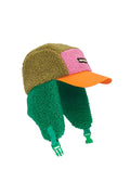 A fleece winter cap with ear flaps, featuring a color-blocked design in olive green, pink, and green, with an orange brim and green chin straps, shown on a light gray background.