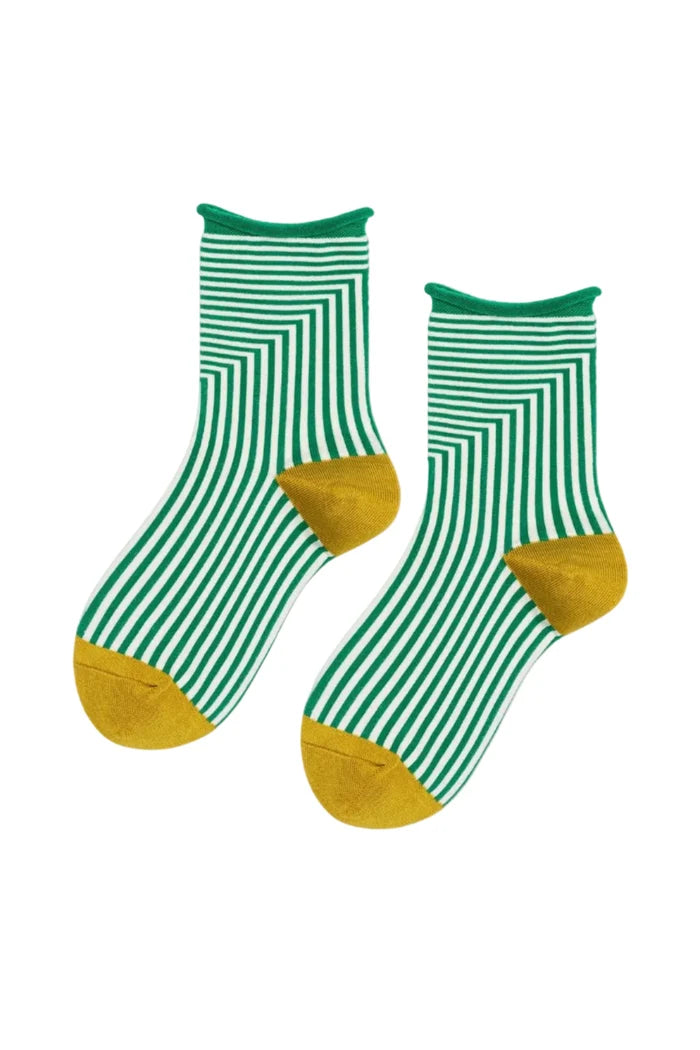 Green and white striped socks with yellow toes on a white background
