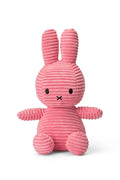 Pink ribbed bunny toy on a white background