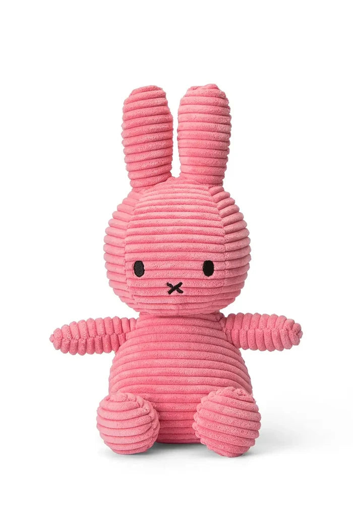Pink ribbed bunny toy on a white background
