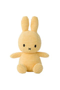 Yellow plush rabbit toy on a white background