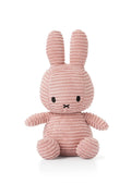 Pink plush bunny toy on a white background