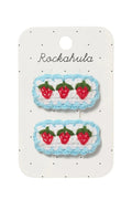 Pair of strawberry-themed hair clips on a Rockahula branded card.