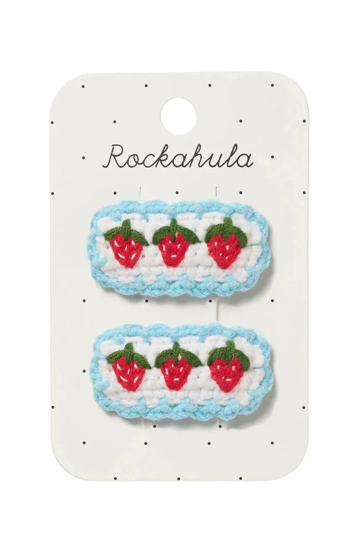 Pair of strawberry-themed hair clips on a Rockahula branded card.