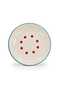 Cream enamelware plate with turquoise rim and graphic tomato pattern.