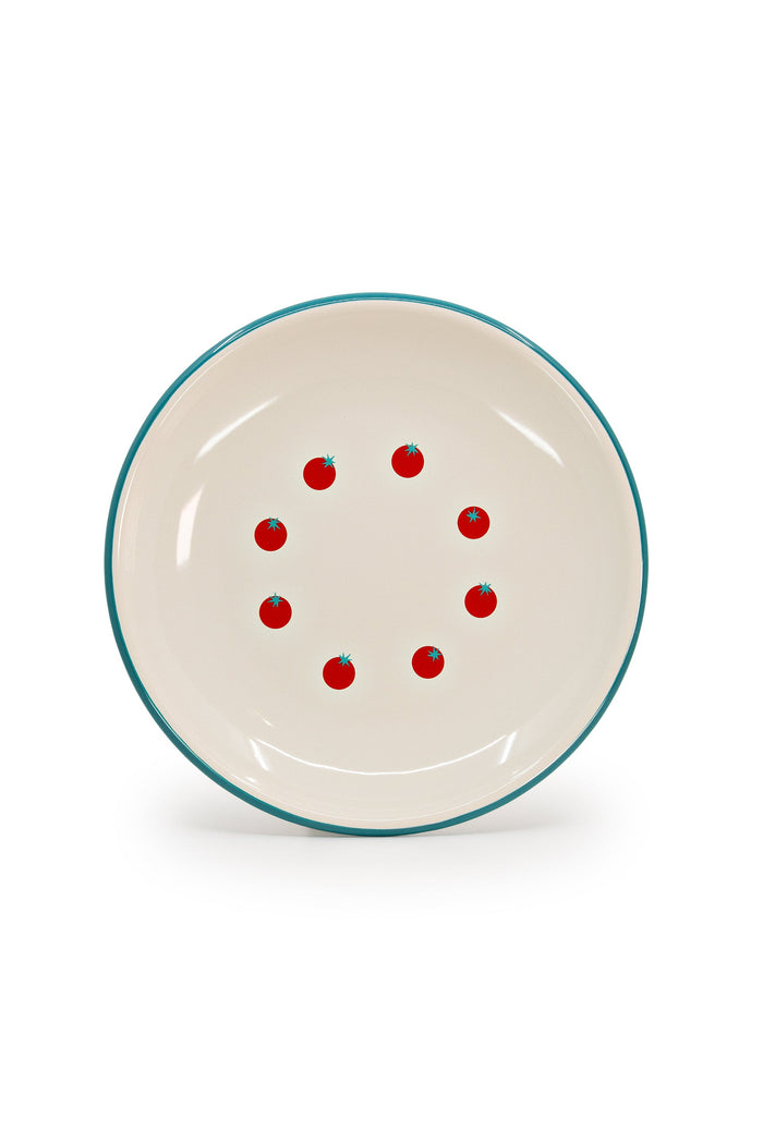 Cream enamelware plate with turquoise rim and graphic tomato pattern.
