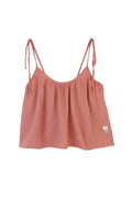 Pink tank top with thin straps on a white background