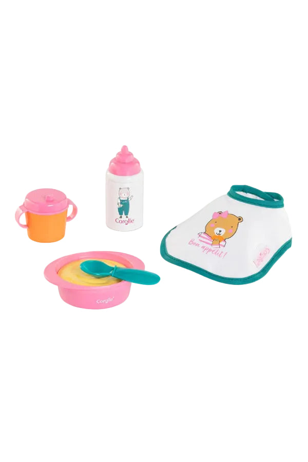 Baby feeding set, including bib, bowl, spoon, sippy cup, and bottle against a white background.