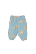 Light blue baby pants with an all-over beige puppy print, featuring an elastic waistband and leg cuffs, shown against a plain off-white background.