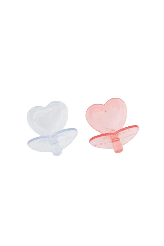 Two heart-shaped pacifiers, one clear and one pink, on a white background.