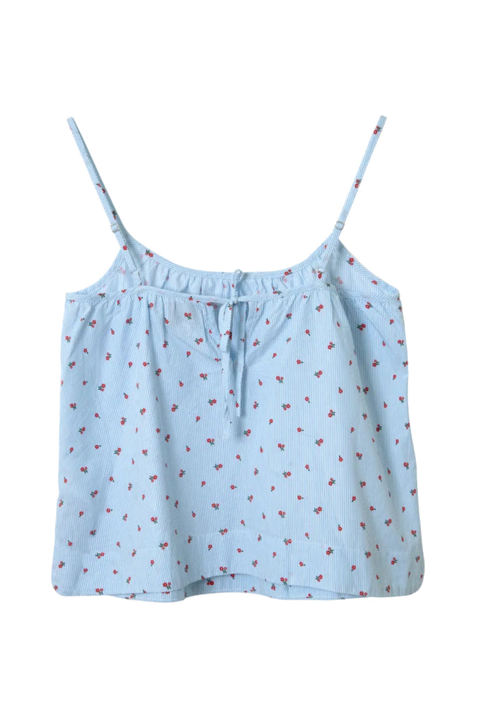 Light blue camisole with red floral pattern on a white background