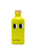 A yellow bottle of extra virgin olive oil branded 'yiayia and friends' with a face drawing on the bottle.