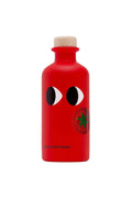 A bright red bottle with a cork stopper, featuring the iconic black-and-white eye logo and a green circular sticker on the front, with 'kayla and friends' printed near the bottom, set against a plain off-white background.