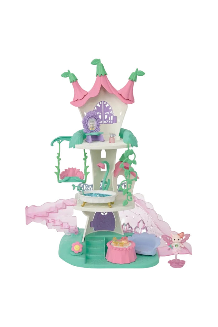 A pink and green fairy-themed castle playset with a small fairy figurine, set against a plain white background.