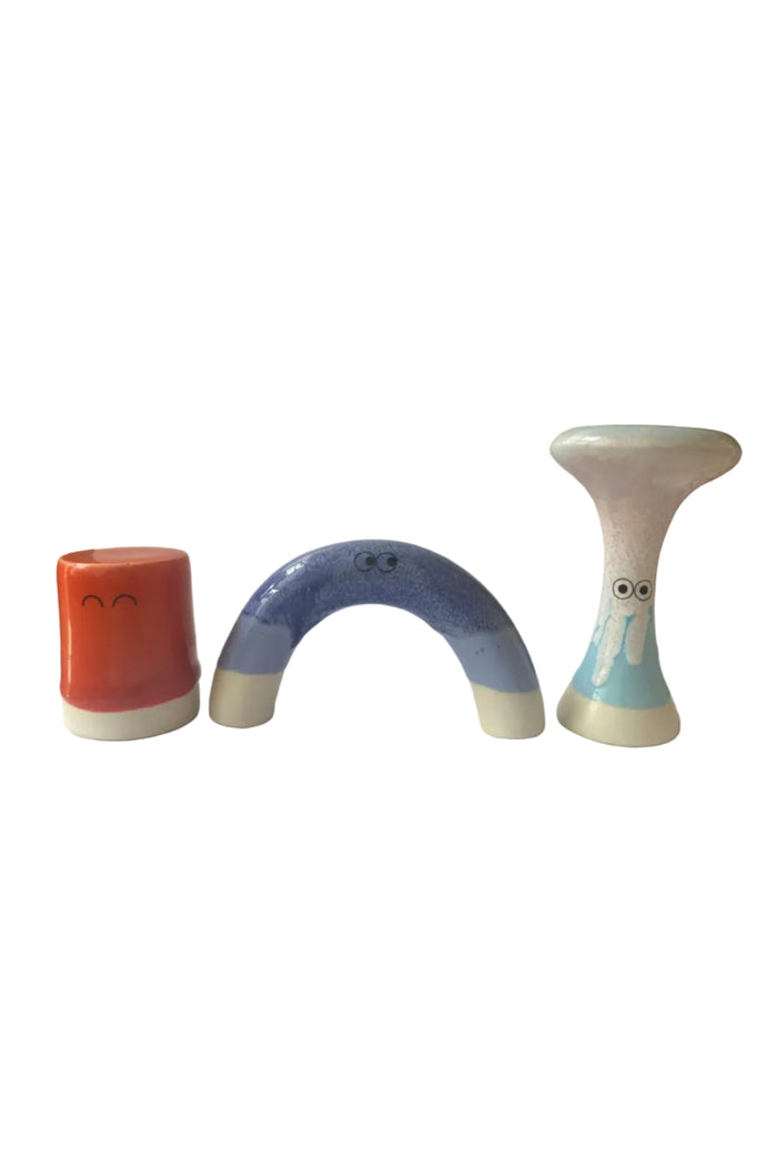Various ceramic figurines with colorful glazes and faces