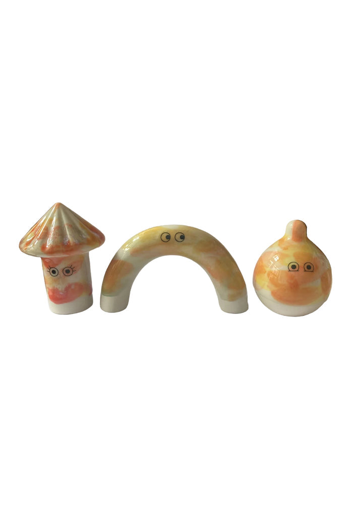 Various ceramic figurines with colorful glazes and faces