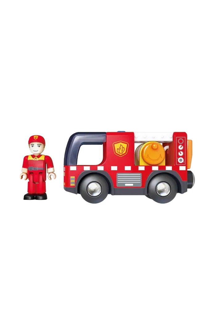 Toy fire truck and firefighter figure on a white background