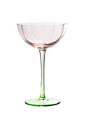 Scalloped coupe glass with a green stem and pink cup