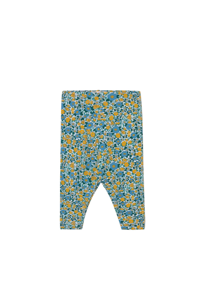 A pair of baby leggings with a dense blue and yellow floral pattern on a light background, shown flat against a solid off-white backdrop.