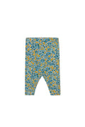 A pair of baby leggings with a dense blue and yellow floral pattern on a light background, shown flat against a solid off-white backdrop.