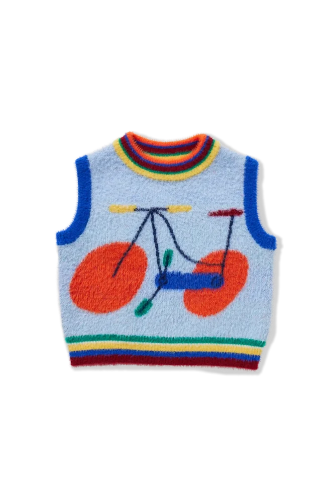 Blue fuzzy kids vest with a rainbow bike graphic.